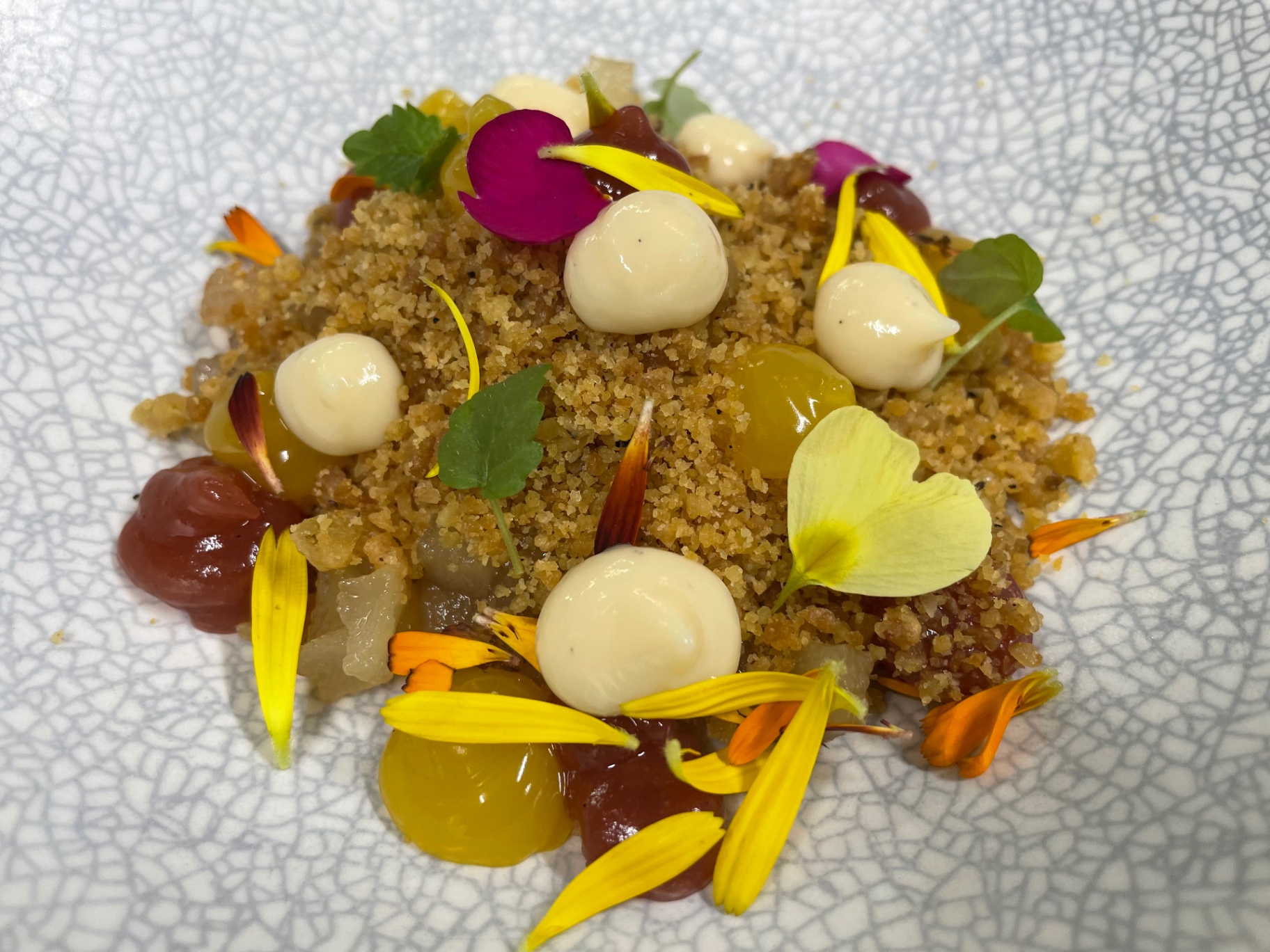 Citrus curd, almond crumb, edible petals