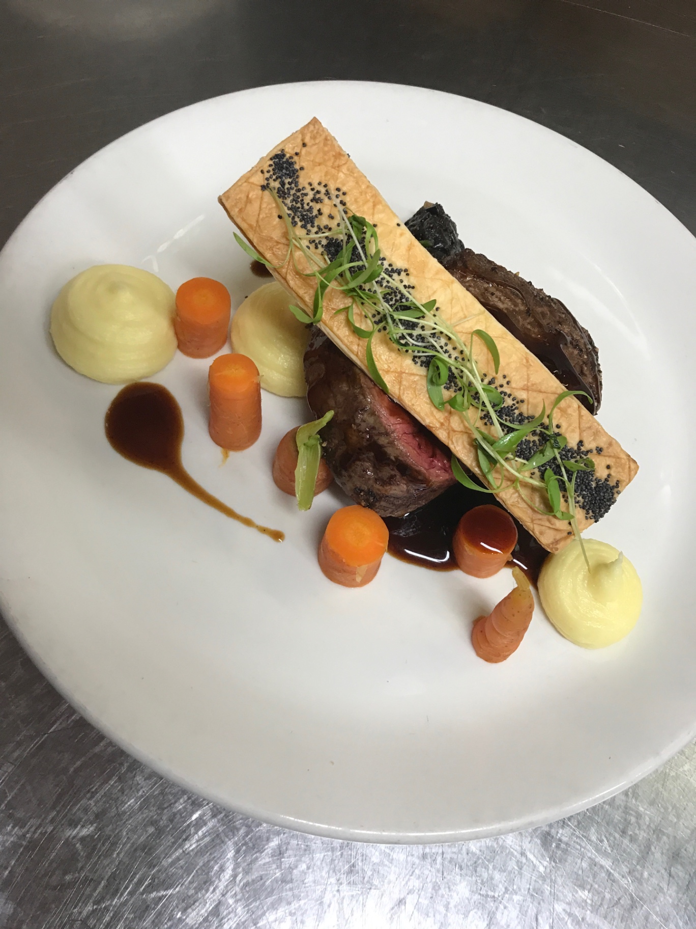 Eye fillet, potato purée, poppy seed tuile, jus